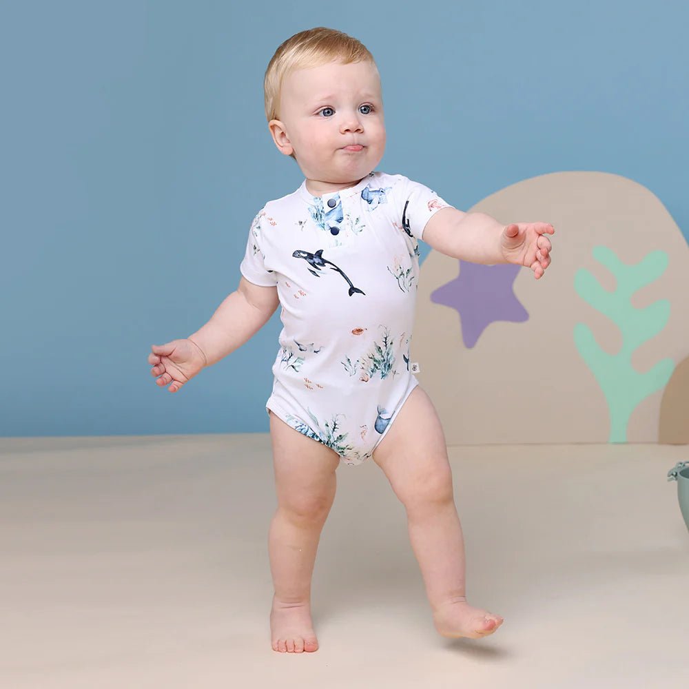 Short-sleeved bodysuit with marine-themed design for babies

