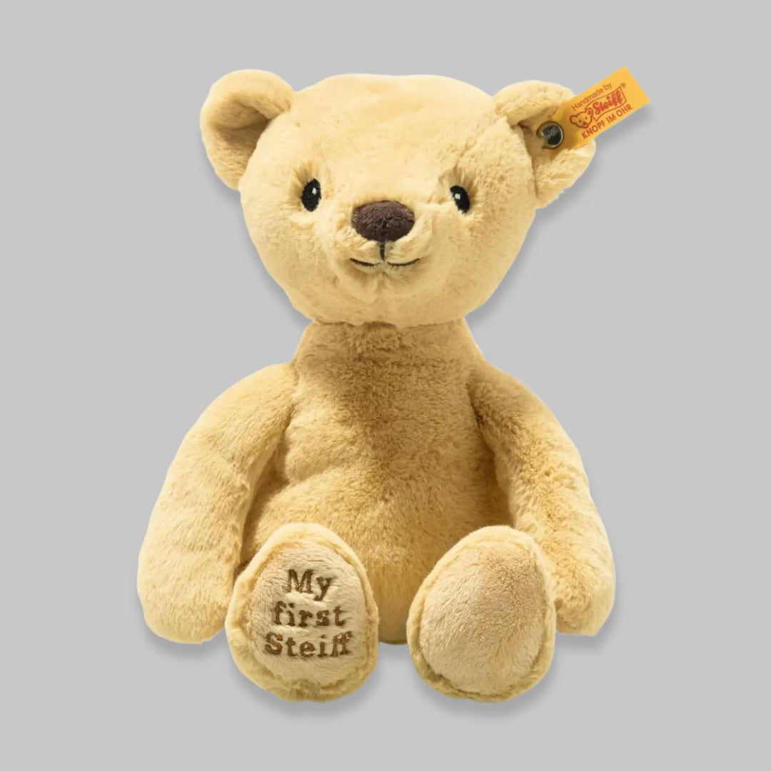 Close-up of Steiff Teddy Bear with signature ear tag – classis brown plush toy for babies