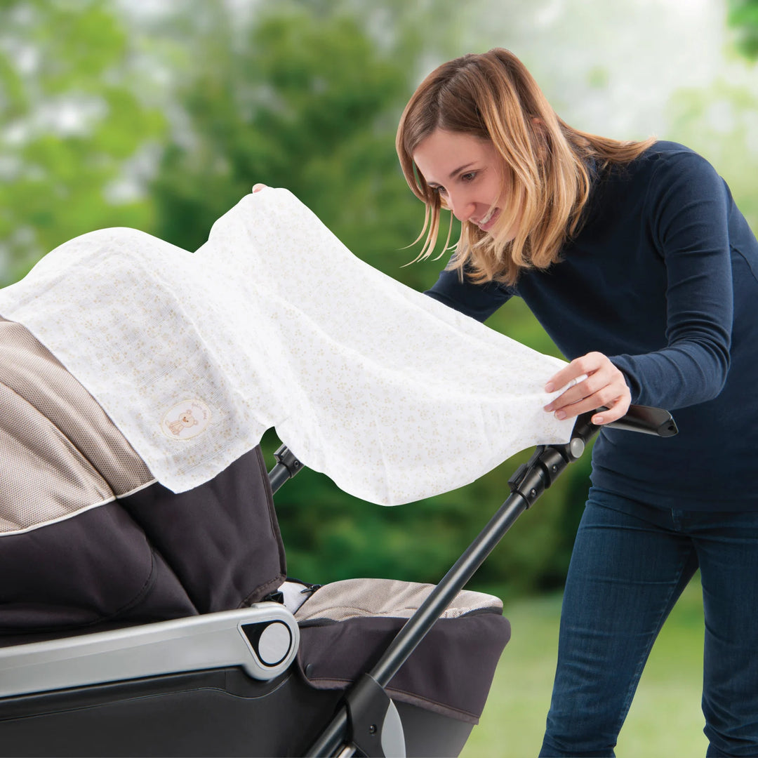Sophie la girafe Baby Swaddle Used as a Lightweight Stroller Cover
