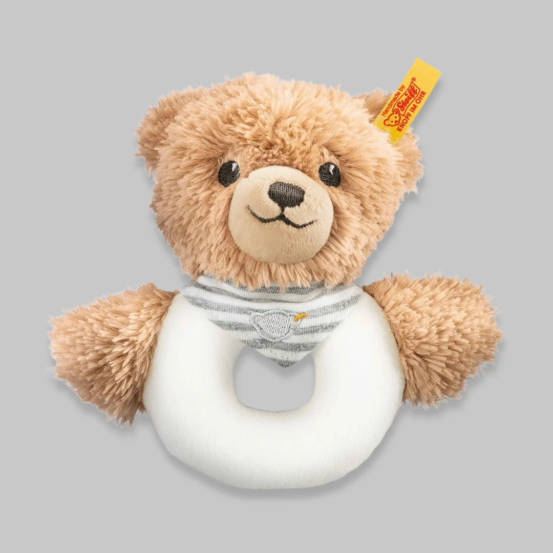 Close-up of plush bear grip rattle in grey – ideal first toy for baby’s early development