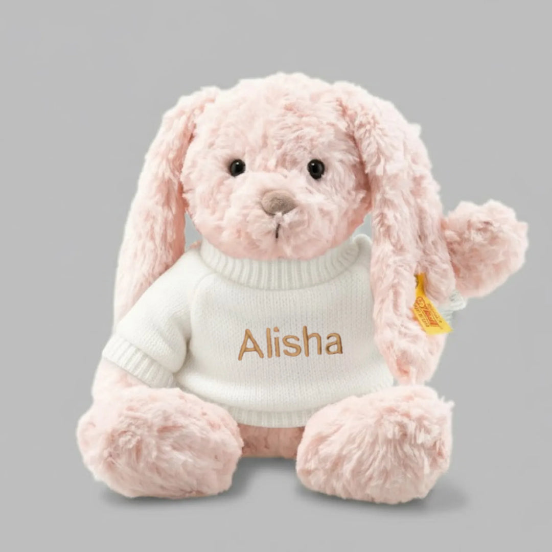 Pink plush bunny wearing a white sweater with 'Alisha' personalised