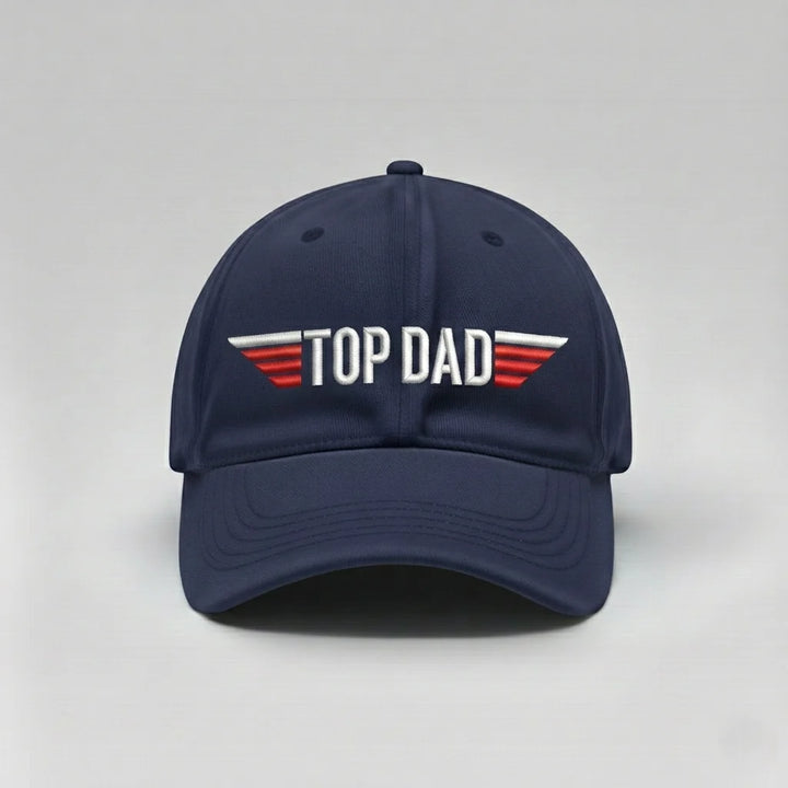 Navy blue cap with 'TOP DAD' text on a light gray background