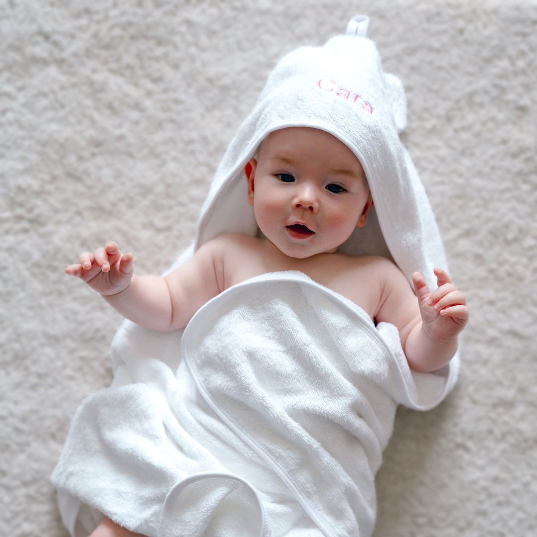 Baby Wrapped in Hooded Towel with "Cara" personalized in Pink thread