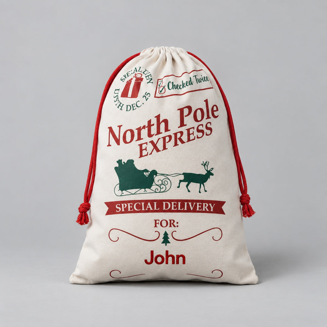 Cream drawstring Christmas sack with red and green North Pole Express design, Santa sleigh and reindeer, “Special Delivery” details and the name “John” in red.
