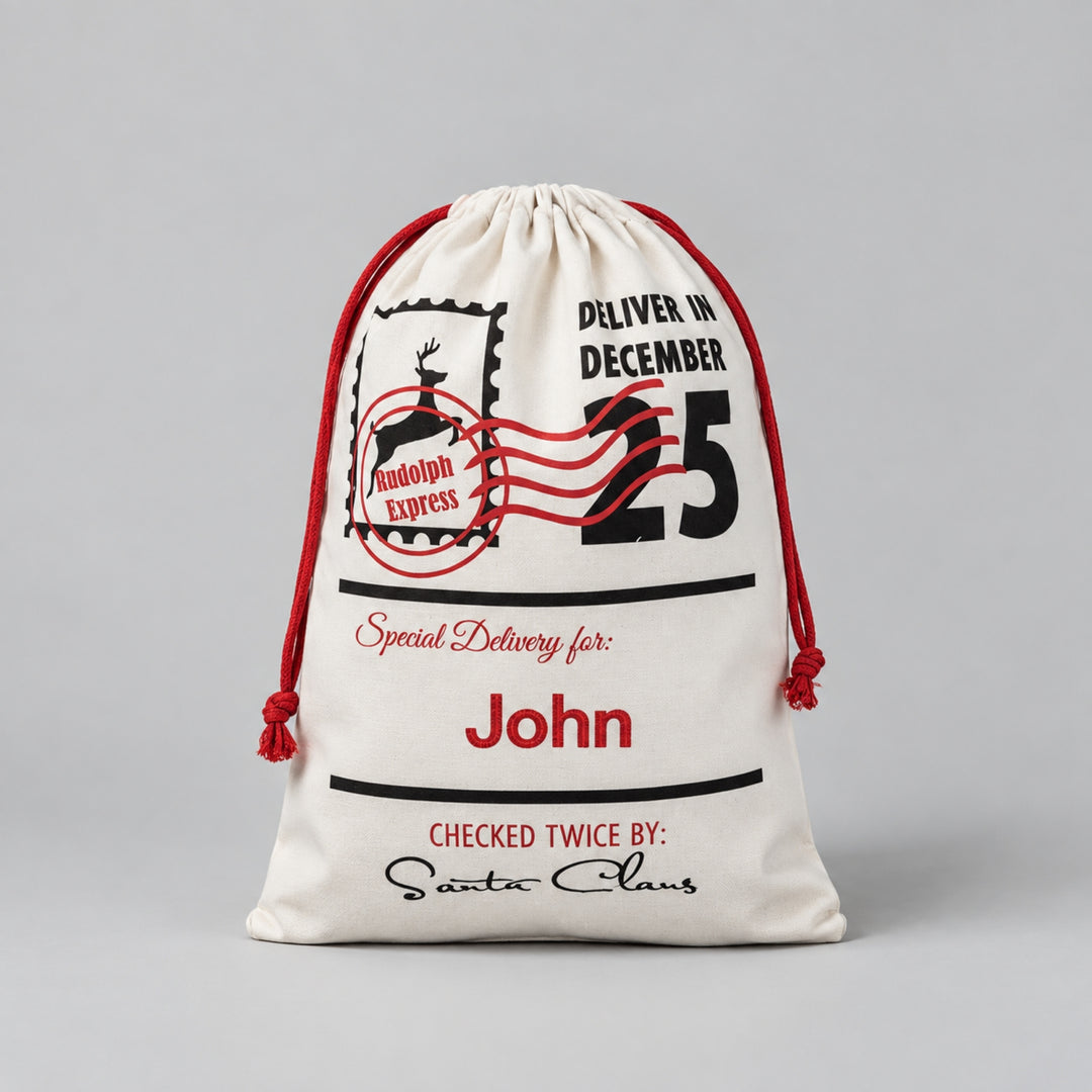 Cream Christmas drawstring sack featuring a Rudolph Express postage design, “Deliver in December 25”, Santa Claus signature and the name “John” personalised in red.