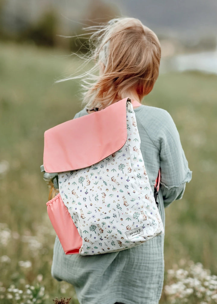 Girl Carrying Mori Official Kids 4-way Backpack in Woodlands Rabbit Design